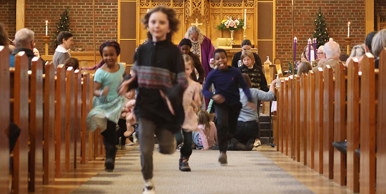 Children running down the isle