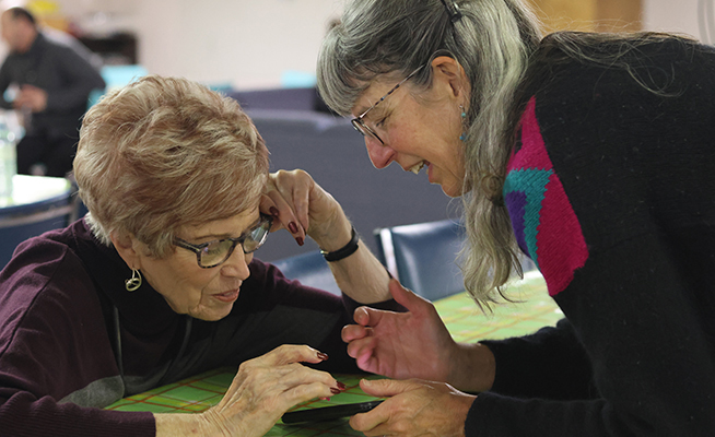 Craft hour with two women deep in discussion