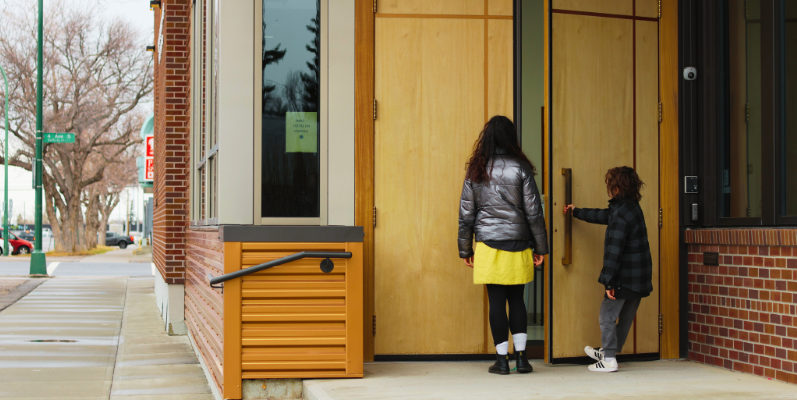 Two people at front entrance